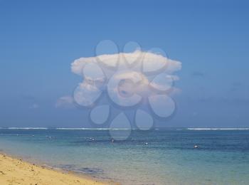 View on ocean with atomic explosion like cloud, Nusa Dua, Bali, Indonesia
