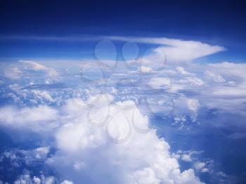 View on cloudscape and blue sky from above