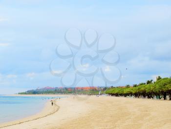 Bali sunny ocean beach with cloudy sky.