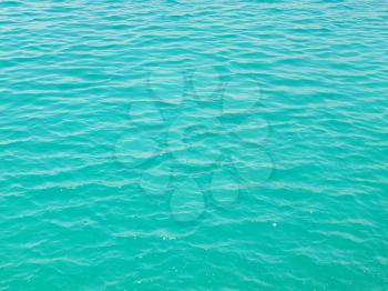 Teal water surface with ripples of Aegean sea