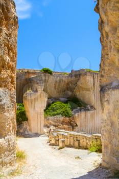 Old Des’hostal quarry entrance in sunny day at Menorca island, Spain.