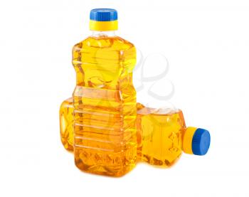 Two plastic bottles with vegetable oil isolated on a white background