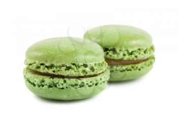 Pair of green macaroons cake isolated on white background