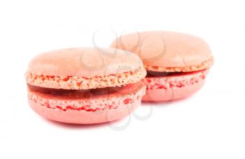 Two pink french macaroons isolated on white background