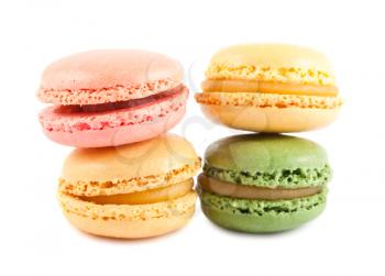 Four colorful french macaroons isolated on white background