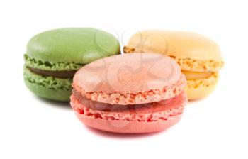 Three french macaroons isolated on white background
