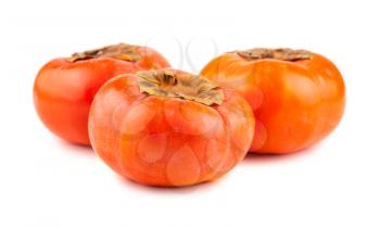 Three ripe persimmons isolated on the white background