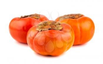 Three persimmons isolated on the white background