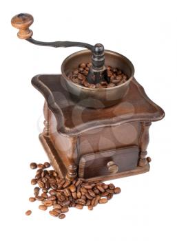 Brown vintage coffee grinder with coffee beans isolated on white background