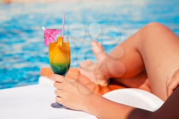 Royalty Free Photo of a Woman by a Pool