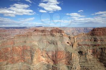 Grand canyon in sunny day with blue sky and clouds
