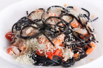 Black cuttlefish spaghetti with tomato sauce and parmesan cheese
