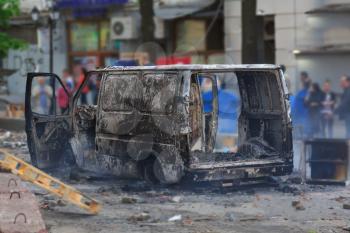 Burned car in the center of city after unrest in Odesa, Ukraine
