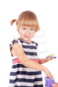 Small girl with purple paint on her palms isolated on white

