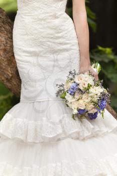 Wedding bouquet in bride's hand, closeup view
