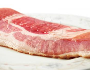 Bacon slices on white background , close up shot