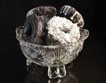 assortment of donuts in a glass dish ,close up