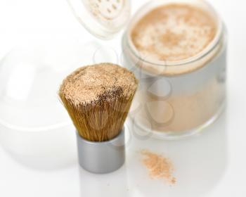 Makeup powder and brush on white background 