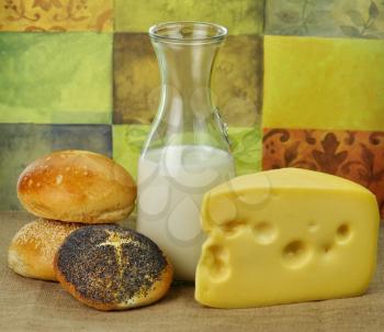 Dairy products arrangement - milk , cheese and bread rolls