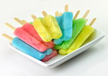 colorful ice cream pops on a white dish