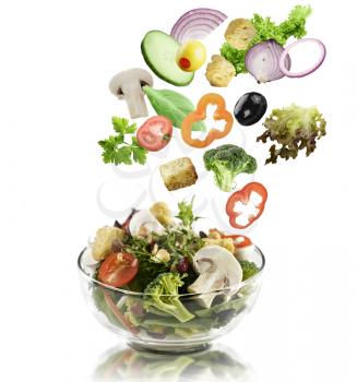 Fresh Mixed Vegetables Falling Into A  Salad Bowl