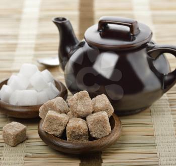 Brown And White Sugar And A Tea Pot