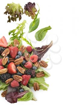 Spring Salad With Berries And Peanuts On White Background