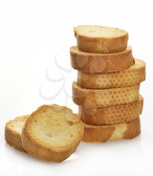 A Pile Of Bread Rusks On  White Background 