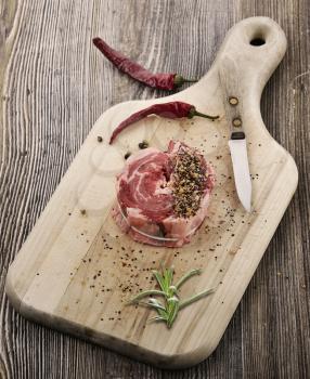 Piece Of Red Raw Meat Steak  On The Cutting Board