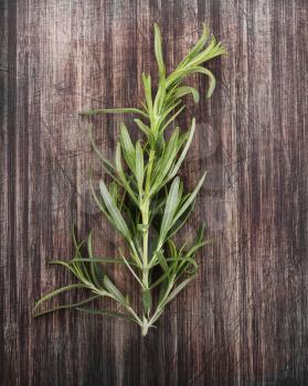 Branch Of Rosemary Isolated On A Cutting Board