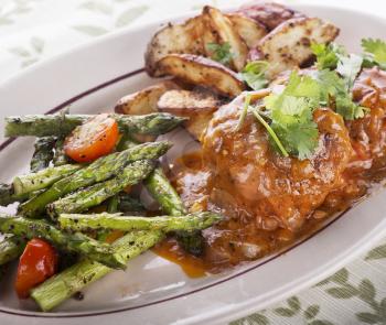 Salisbury Steak Patties With Roasted Asparagus Tomatoes And Potatoes