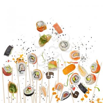 sushi rolls and ingredients with wooden chopsticks isolated on white background