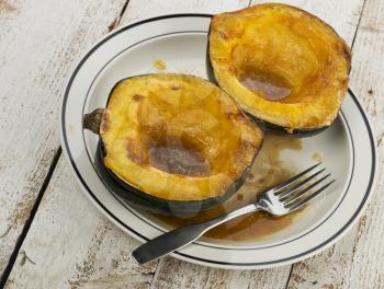 Acorn Squash Cooked With Brown Sugar And Butter in a plate