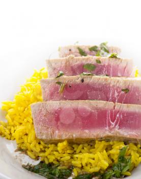 Ahi Tuna Steak With Rice and herbs sauce, close up