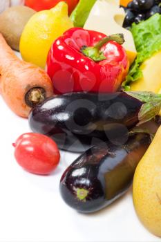 Fresh vegetables and fruits on white
