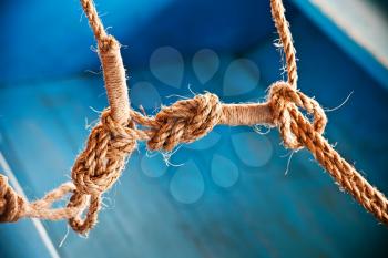 Close up ship ropes with a knot 