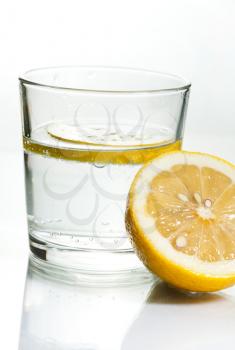 Drink with lemon on white background