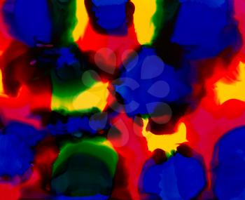 Blue red yellow spots merging.Colorful background hand drawn with bright inks and watercolor paints. Color splashes and splatters create uneven artistic modern design.