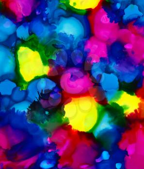 Bright blue with yellow and pink spots.Colorful background hand drawn with bright inks and watercolor paints. Color splashes and splatters create uneven artistic modern design.