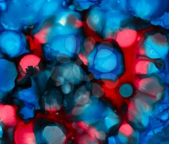 Blue red black paint uneven spots .Colorful background hand drawn with bright inks and watercolor paints. Color splashes and splatters create uneven artistic modern design.