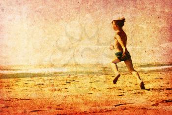 vintage picture of a young child running on a beach