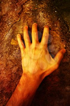A human Hand on stone