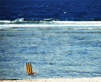 Royalty Free Photo of a Chair on a Beach