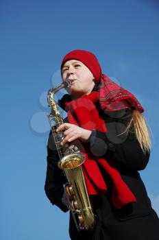 Royalty Free Photo of a Woman Playing a Saxophone