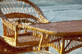 Royalty Free Photo of a Wicker Chair and Table