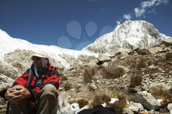 Royalty Free Photo of a Mountain Climber Relaxing