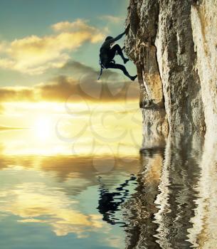 Royalty Free Photo of a Rock Climber and Reflection