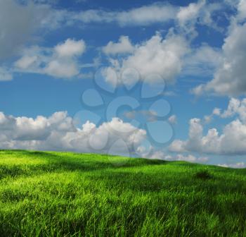 Royalty Free Photo of a Field and Clouds