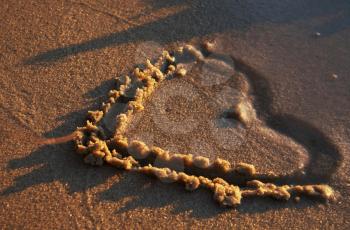 Royalty Free Photo of a Heart Drawn in the Sand