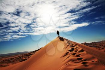 Royalty Free Photo of a Man Hiking in the Desert